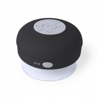 Altavoz de color negro de forma circular con botones indicador de funciones al centro y a los lados. 