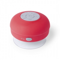 Altavoz de color rojo de forma circular con botones indicador de funciones al centro y a los lados. 